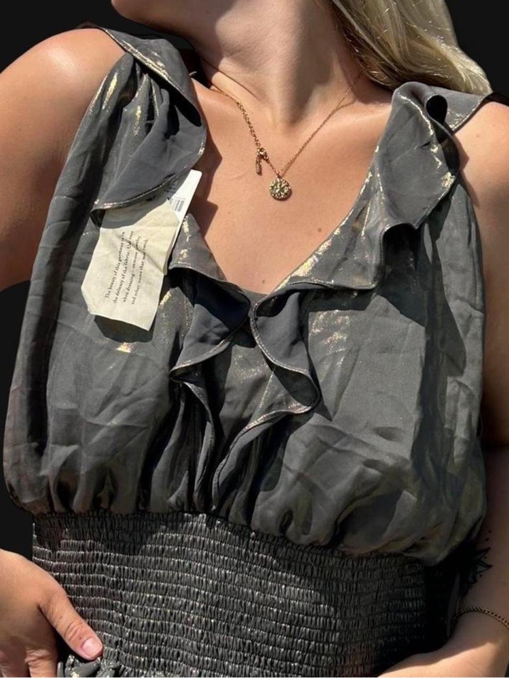 Anthropologie metallic statement top